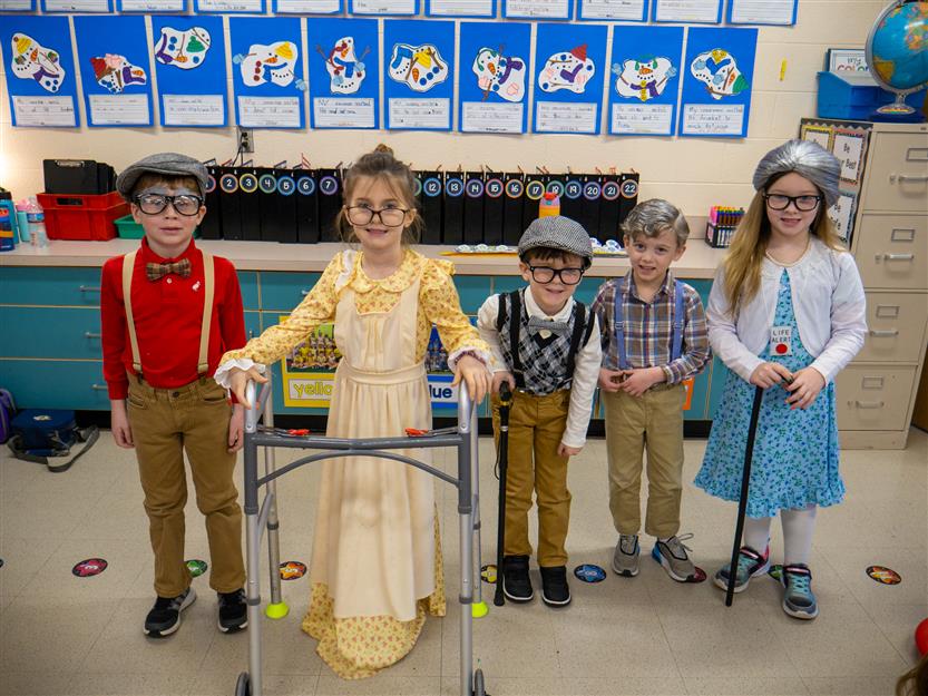 group of students dressed as 100 year olds